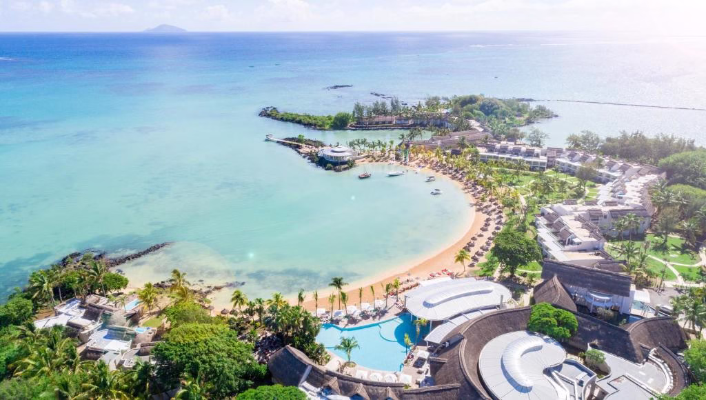 an aerial view of the beach at a resort at LUX* Grand Gaube Resort & Villas in Grande Gaube