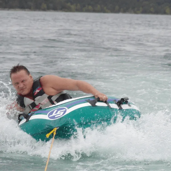 Table Rock Lake water sports tubing and boating action shot.