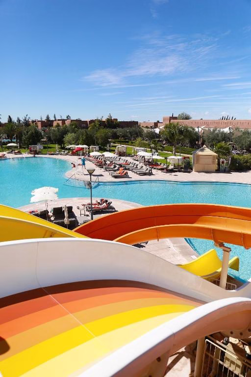 a view of a swimming pool with a resort at Kenzi Club Agdal Medina - All Inclusive in Marrakesh