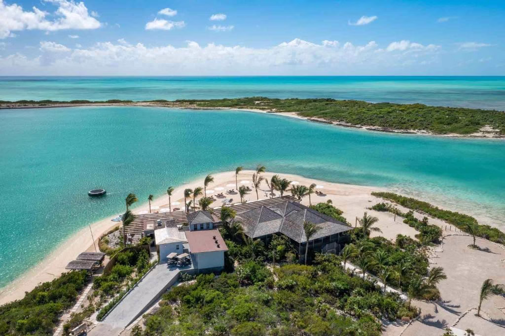 an aerial view of a house on a beach at Ambergris Cay - Private Island All Inclusive in Big Ambergris Cay