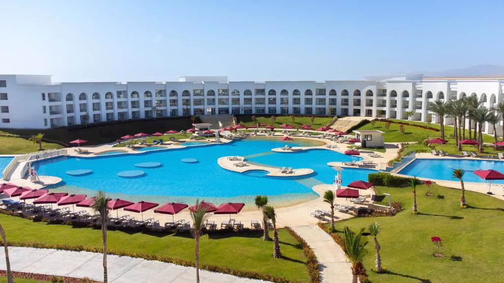 an aerial view of a resort swimming pool at Rixos Radamis Sharm El Sheikh in Sharm El Sheikh